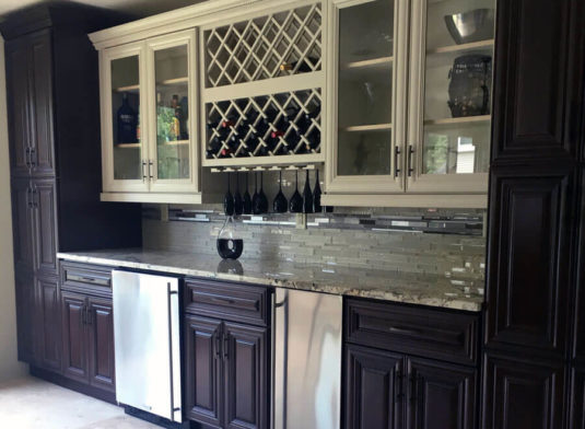 Kitchen with white cabinets and marble island